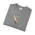 Folded gray t-shirt with a graphic of a person on a windsurf board and 'Catch the Wind' text.